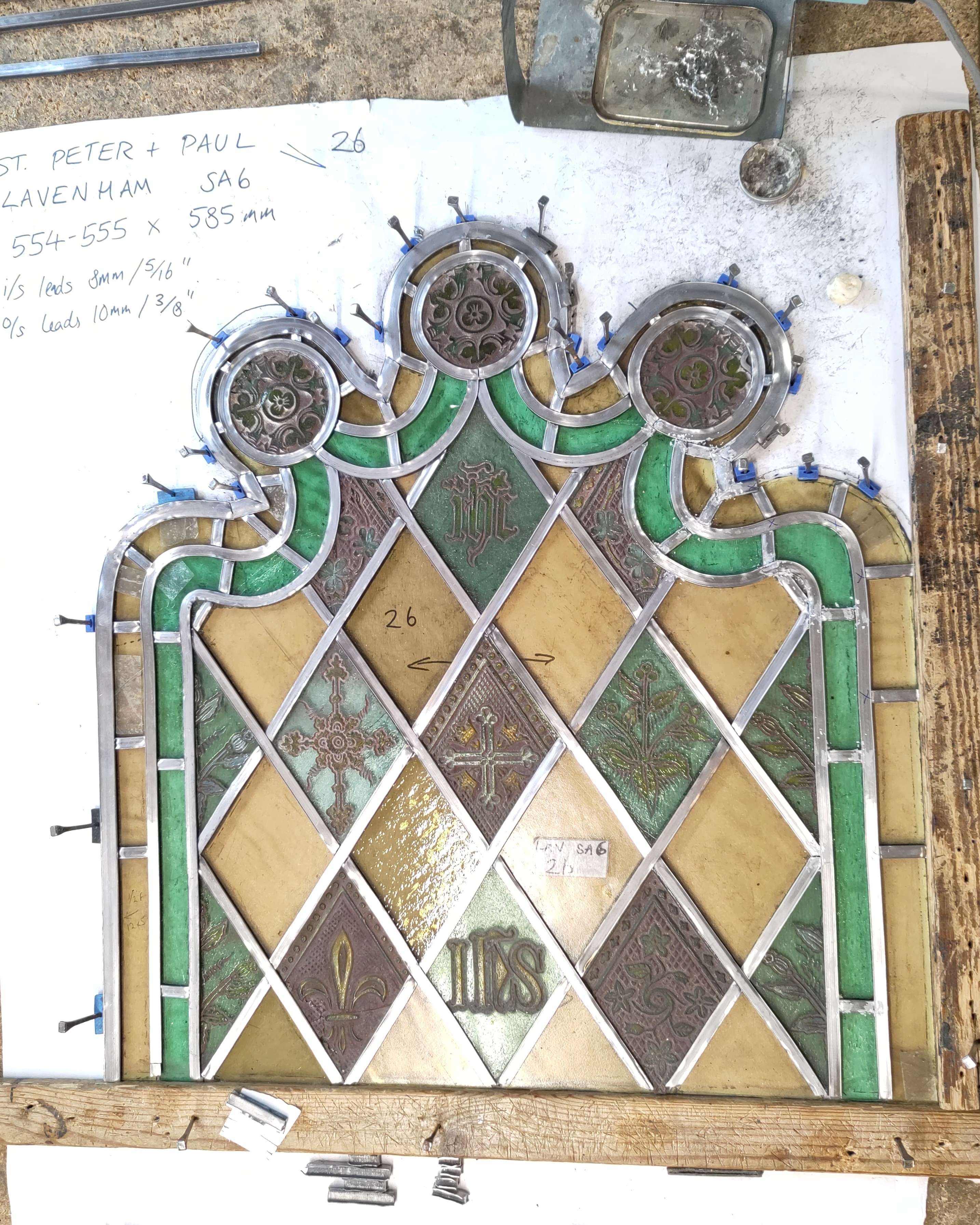 An image of a head panel, leaded up and ready to be soldered.